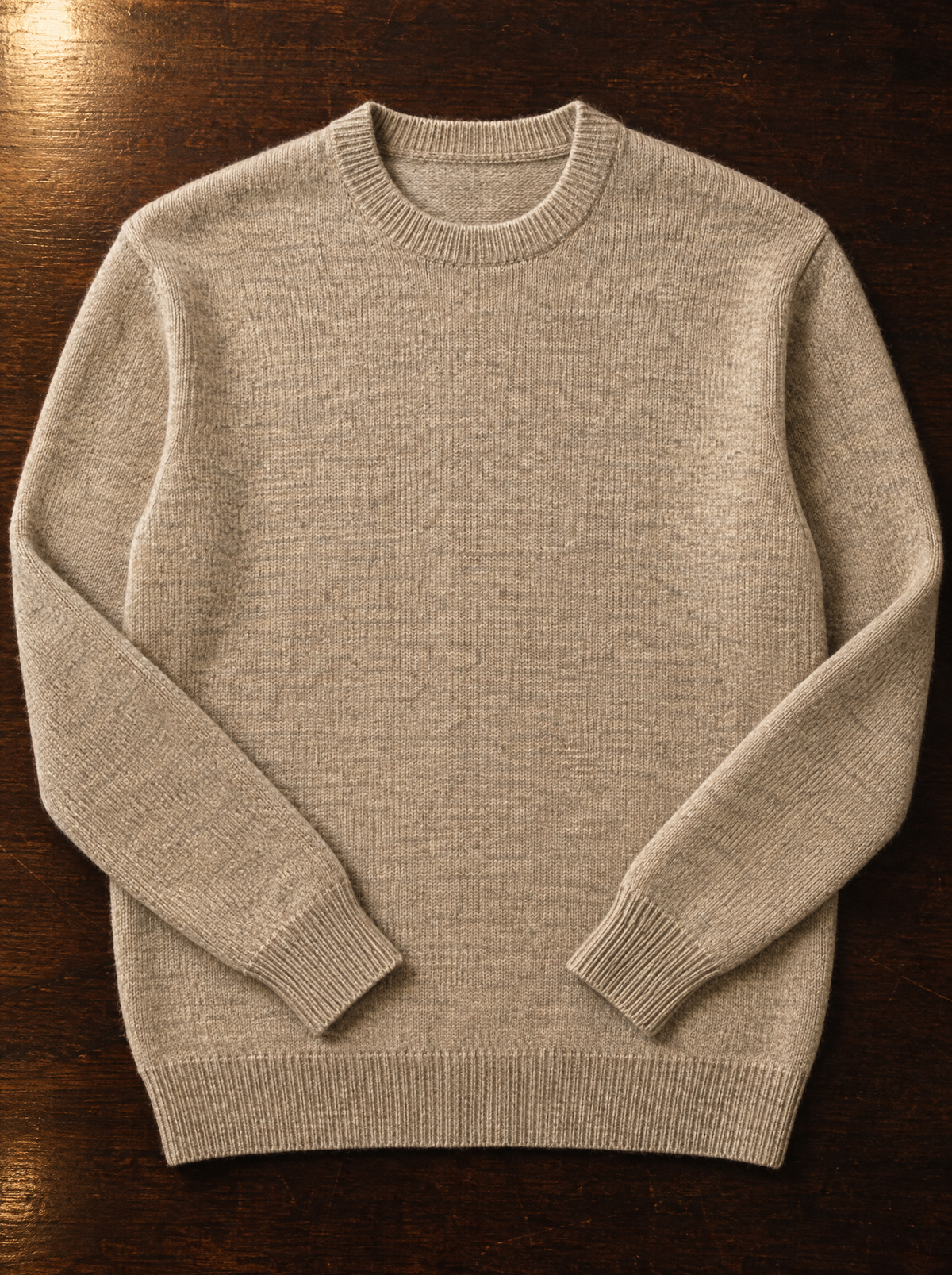 Oatmeal merino wool crew neck sweater folded flat